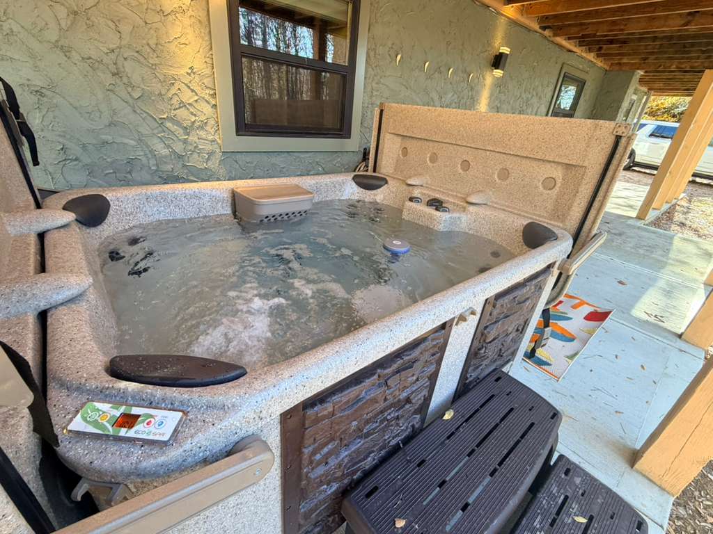Soak your stress away! Enjoy this private, bubbling hot tub tucked away just steps from the house. Perfect for unwinding.