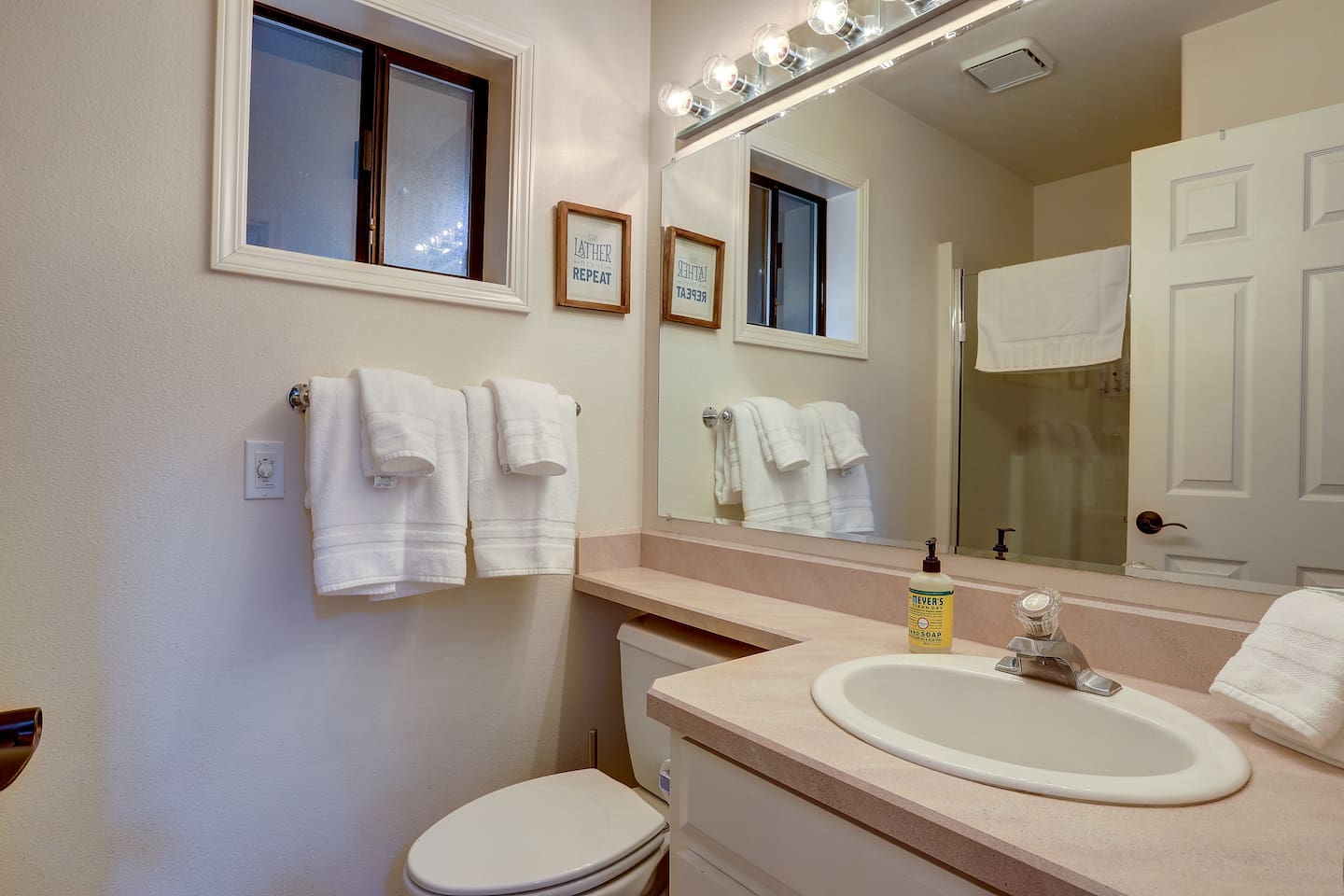 This full bathroom with a shower is on the main level, adjacent the dining room and the downstairs bedroom. 