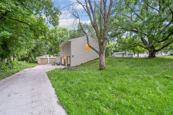 The long spacious driveway is great for parking or playing outdoor games.