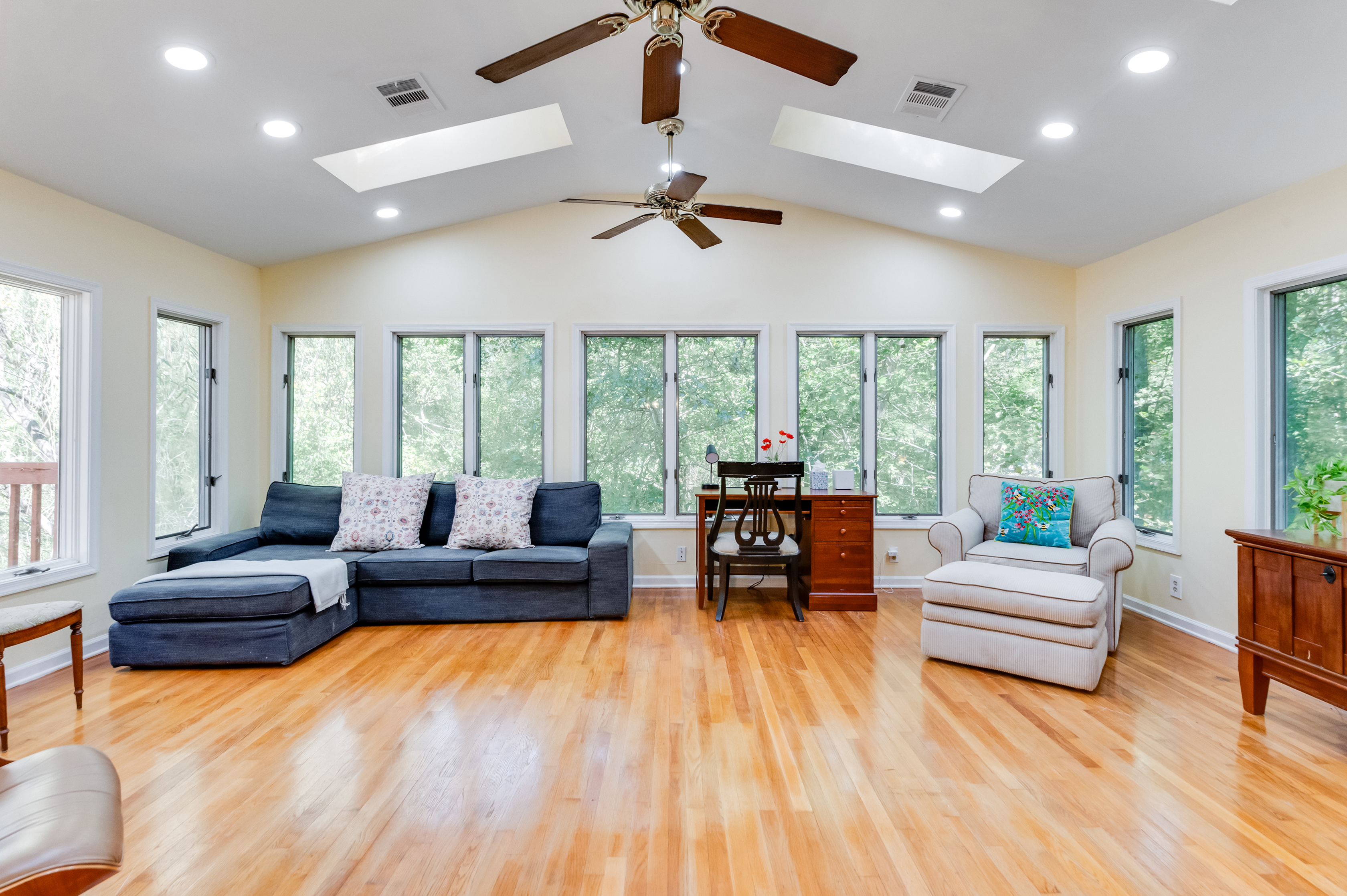 Living Room: Spacious living area with a breathtaking forest view and inviting decor!