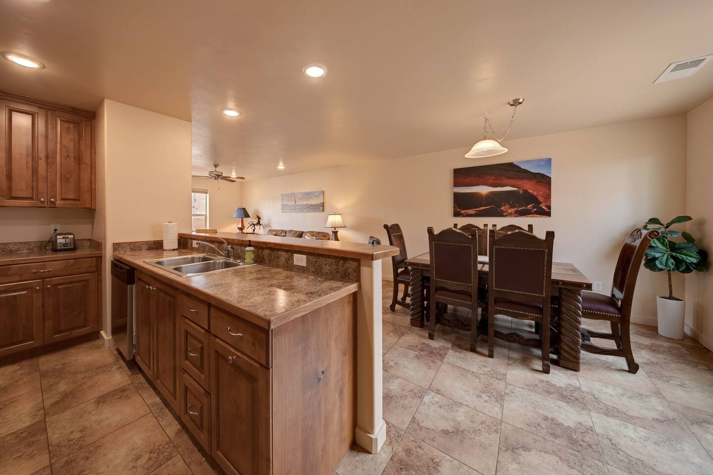 Bright cheerful open concept kitchen, dining, and family room