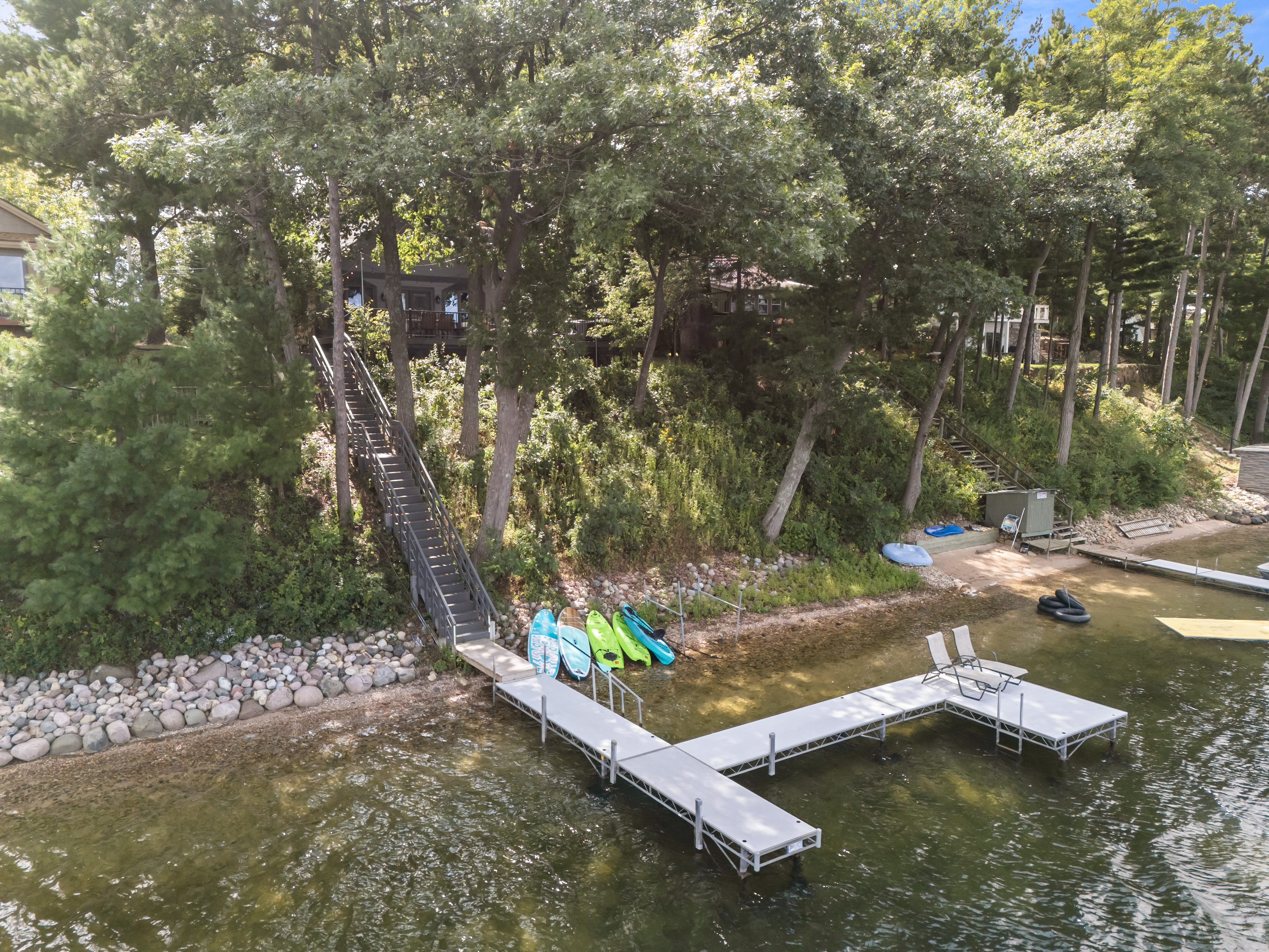 Stretch out on the two lounge chairs at the end of the pier—the perfect spot for sunbathing by the water.