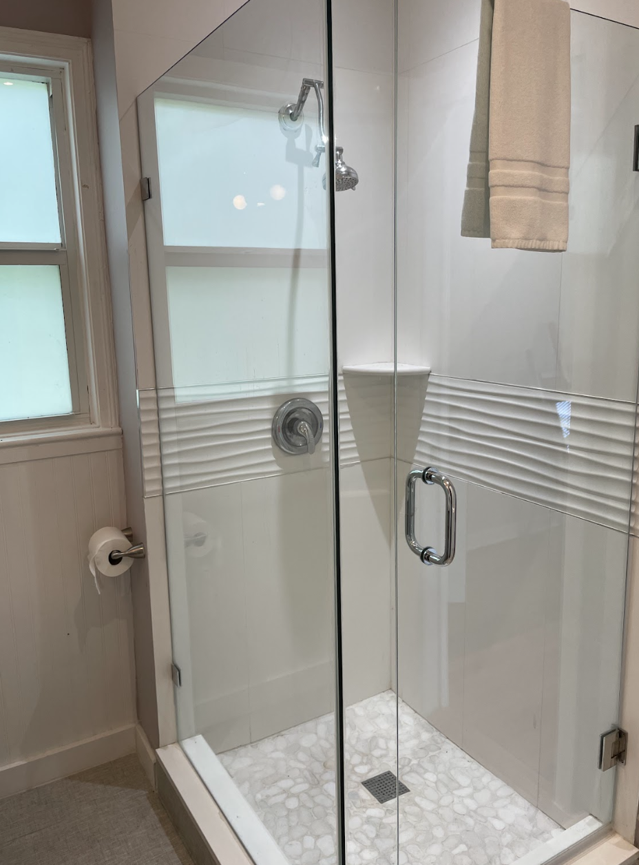 The second bathroom can be accessed from the hallway or the bedroom, and is completely renovated with a new shower.