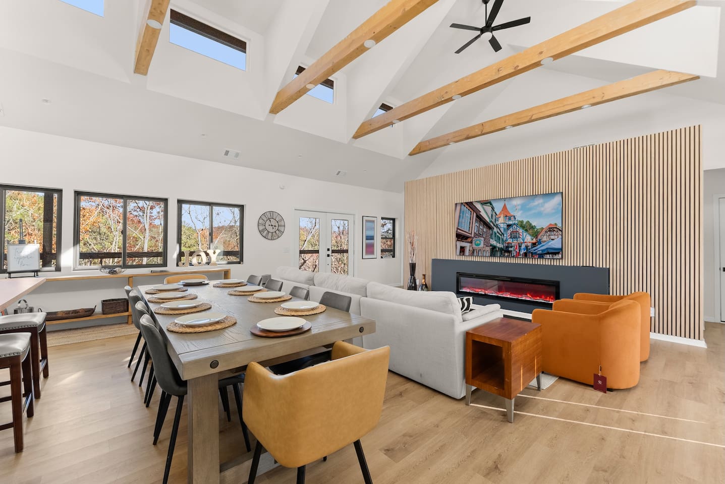 Bright, open-concept living and dining area with large windows letting in natural light—perfect for relaxing and entertaining.
