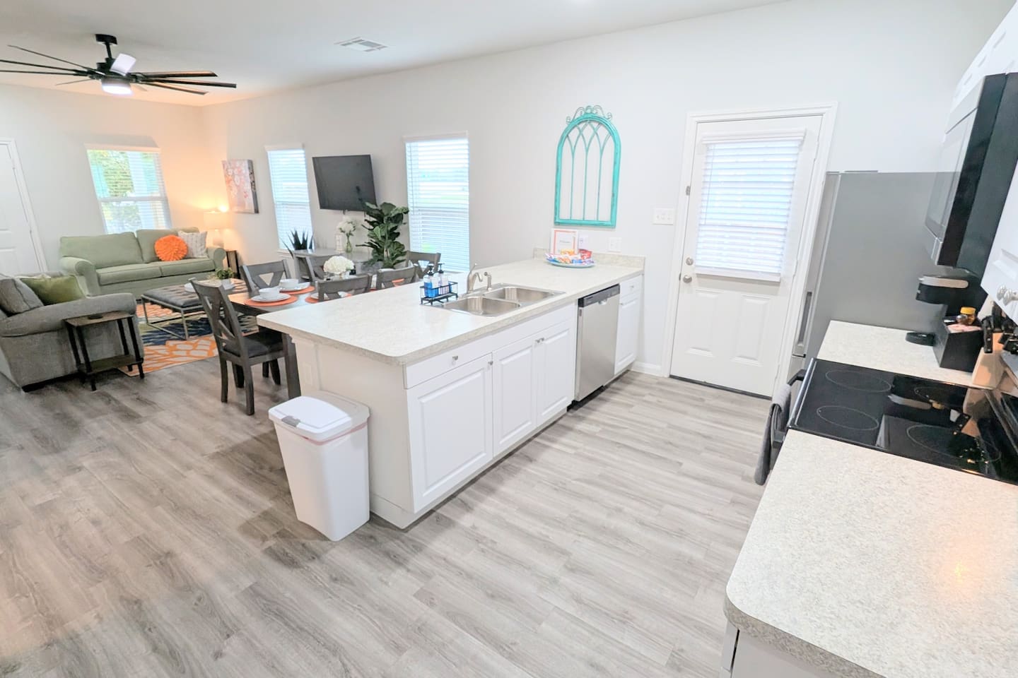 Open concept kitchen, living, and dining space makes it easy to spend time with family. 