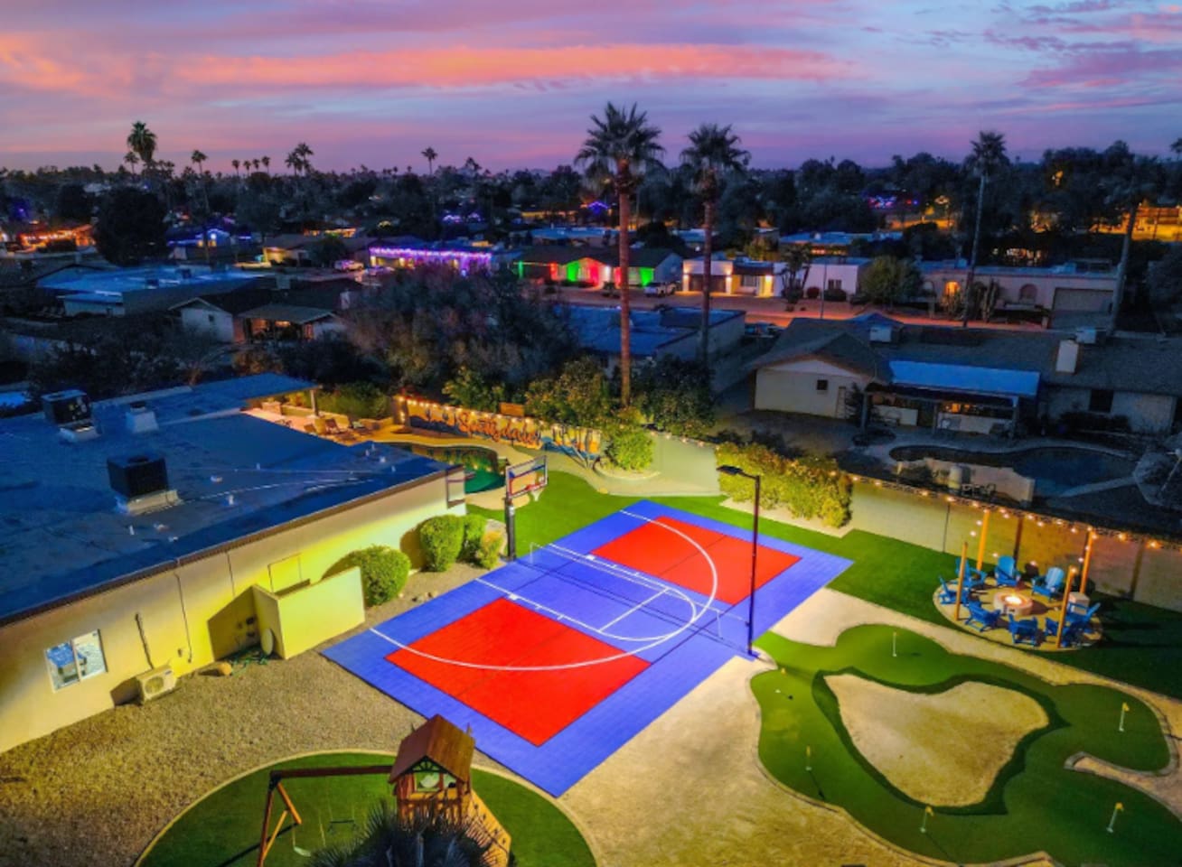 The sport court takes center stage as the sky turns pink — built for competitive games that run late into the evening.