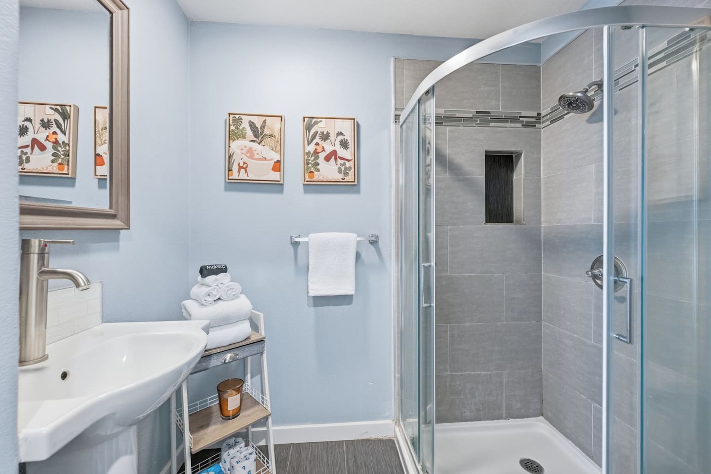 Full bathroom with walk-in shower and vanity. Stocked with shampoo, conditioner, and shower gel by Ginger Lily Farms. One of three full bathrooms serving all 10 guests.
