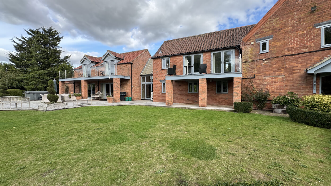 Main house rear garden to decking and main bedrooms