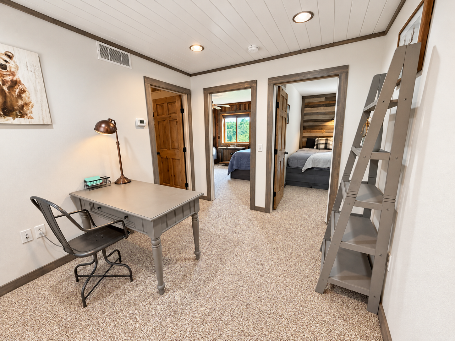 At the top of the stairs, this landing connects three private bedrooms and includes a handy desk/workspace—an easy, functional layout that gives your group convenient access to the upstairs sleeping areas.