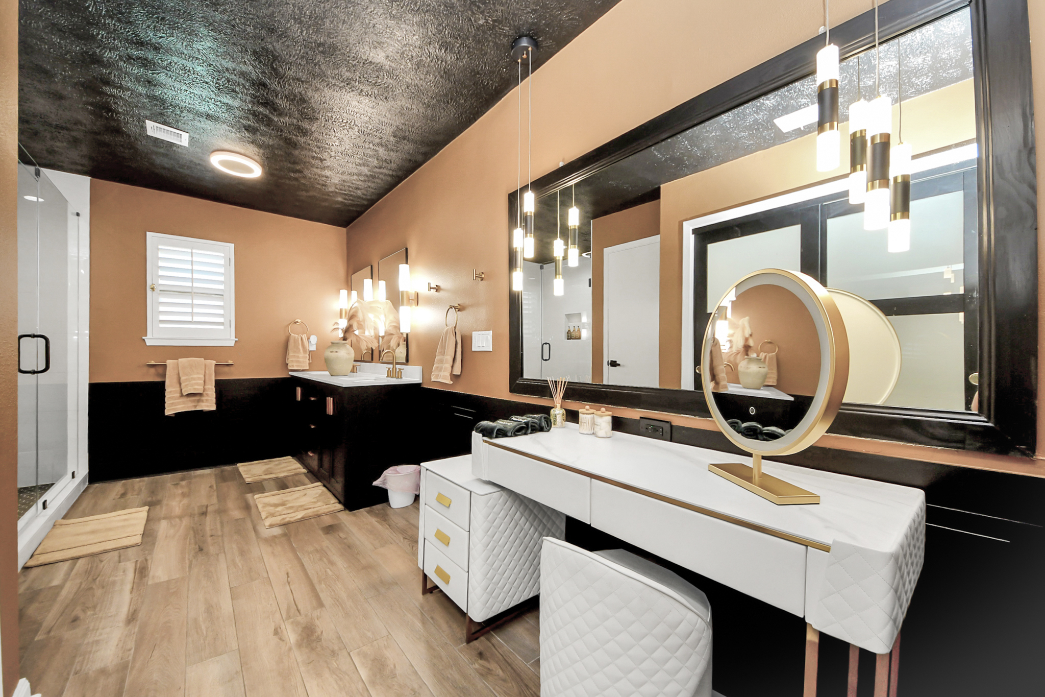 Huge Updated Bathroom with a luxe remodeled shower, dual sinks and a vanity area for the ladies to get ready at. 