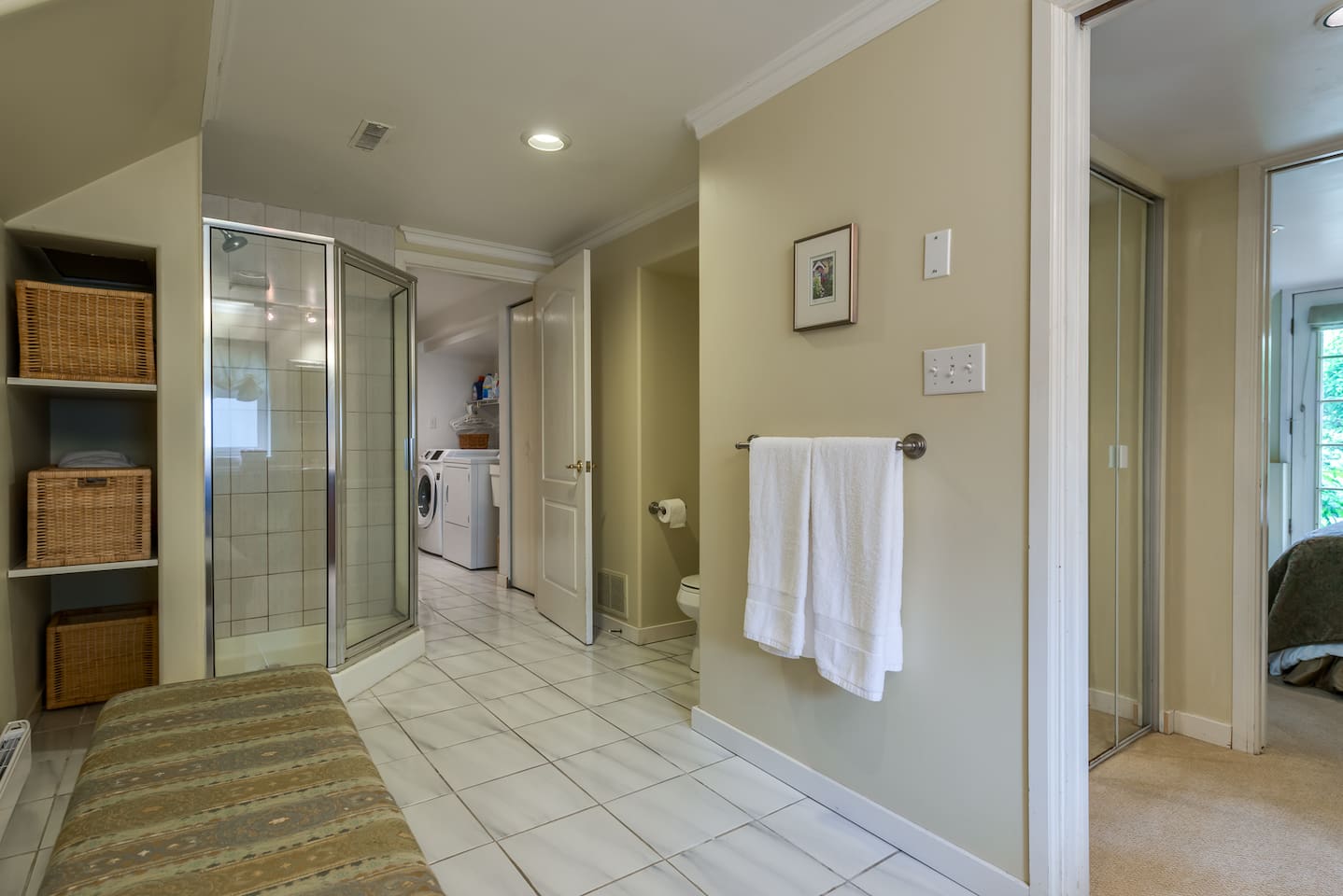 Master bathroom with doors connecting to the master bedroom and one through to the laundry area.