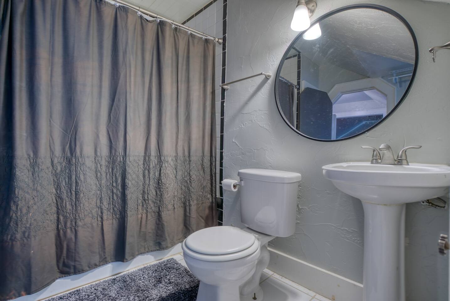 Enjoy the flexibility of a shower or bath in this spacious full bathroom.