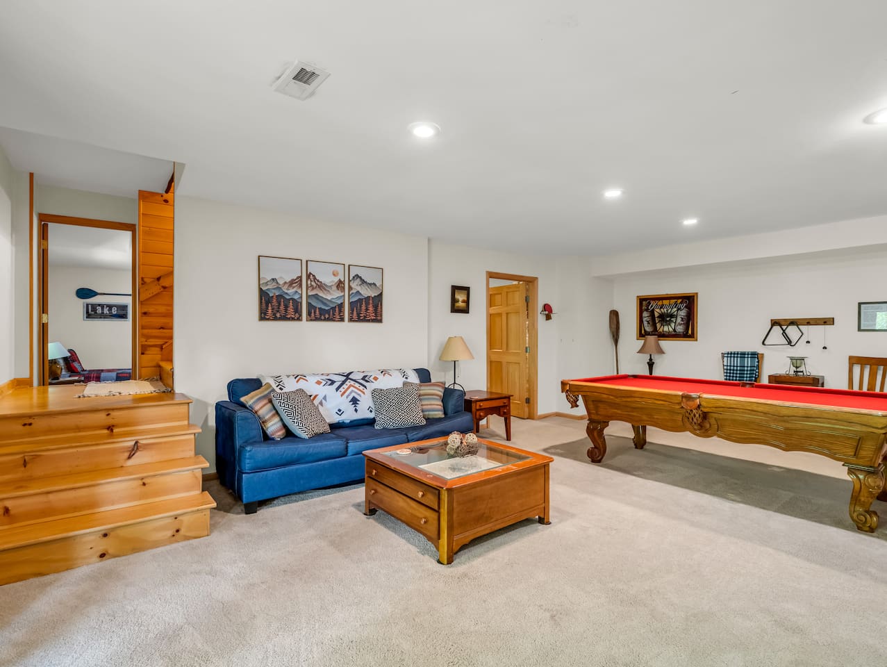 Basement with seating, pool table, dart board, television, and plenty of board games