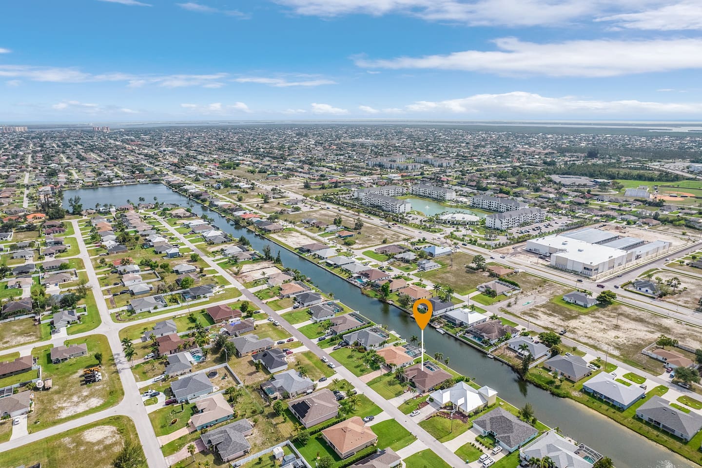 Explore this stunning canal neighborhood from above, where waterfront living shines!