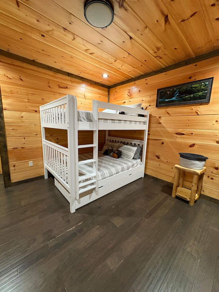 Queen bunk beds suitable for adults.  Pull out twin trundle.  I also have a roll away twin bed.