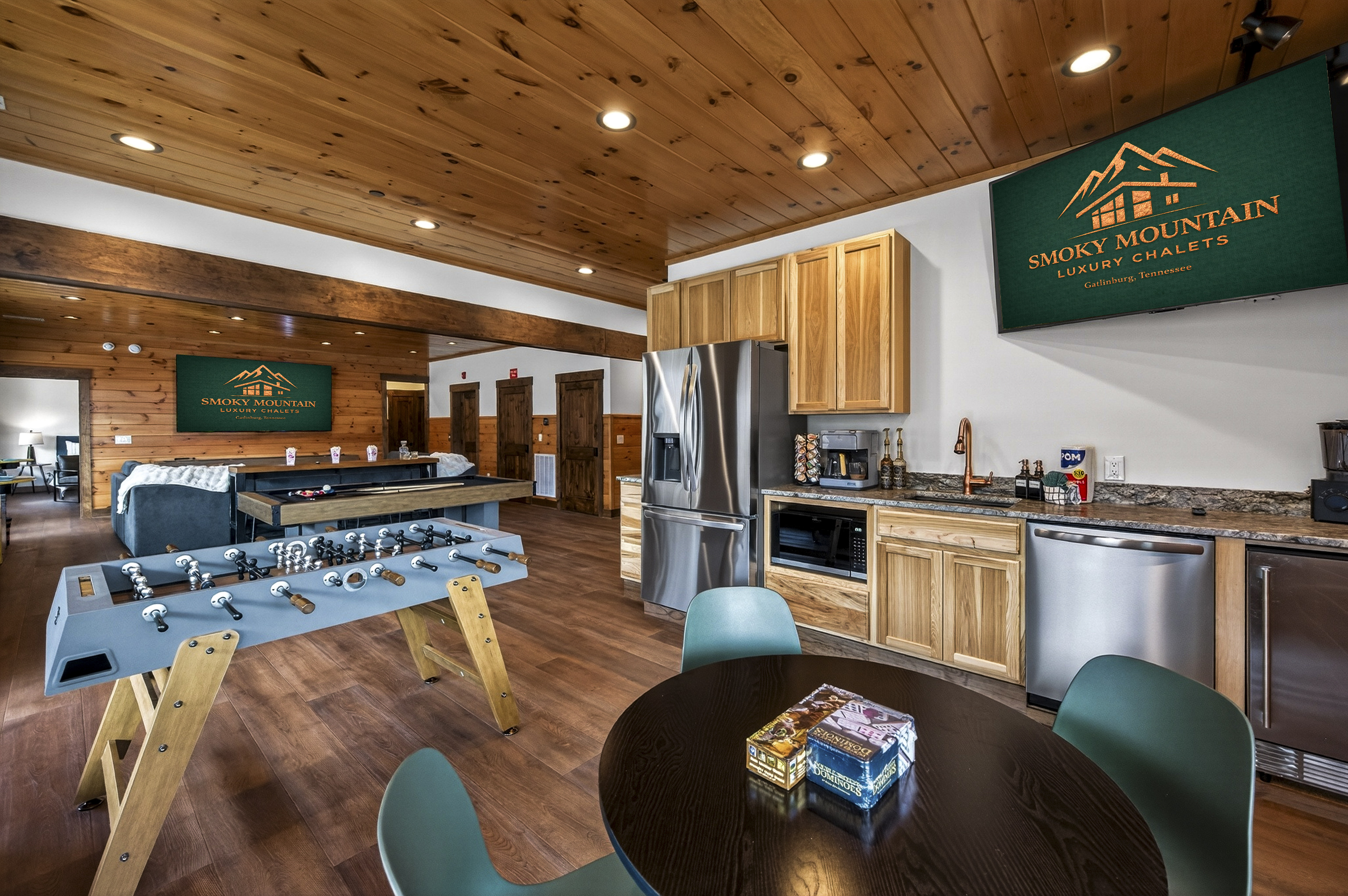 Ultimate Game Room -Watch movies or the big game on the 100-inch TV, relax on the plush sectional, or enjoy bar-top seating. Play pool, shuffleboard, foosball, and arcade tables, with a kitchenette for snacks and drinks—perfect for family fun & game nights