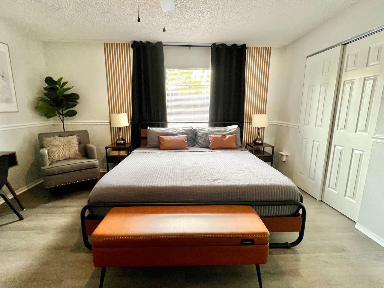Get ready to sleep like royalty in this modern king-size bedroom, where the bed is big enough for you to practice your starfish pose in ultimate comfort