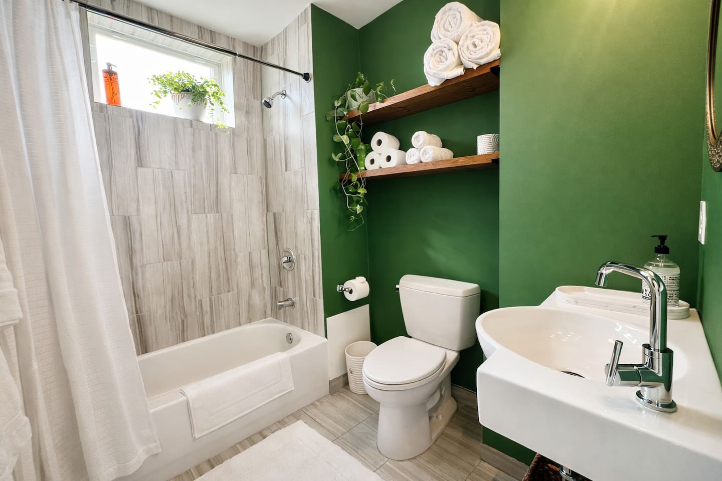 Full bathroom with shower and modern fixtures.