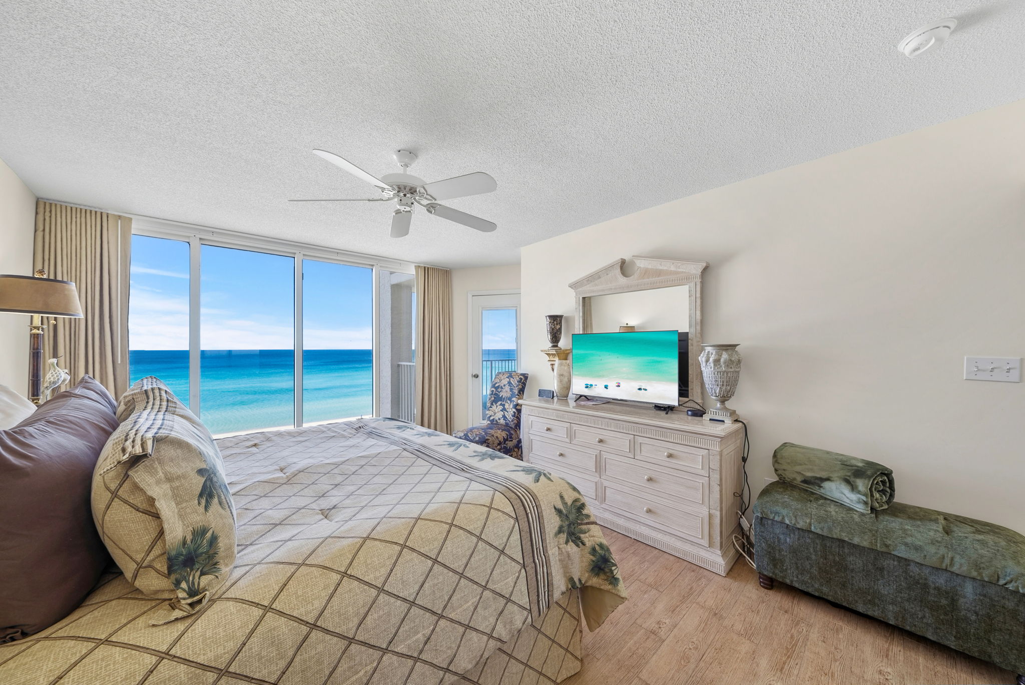 Master king suite with floor to ceiling window views of the beach, private balcony access and en-suite bathroom