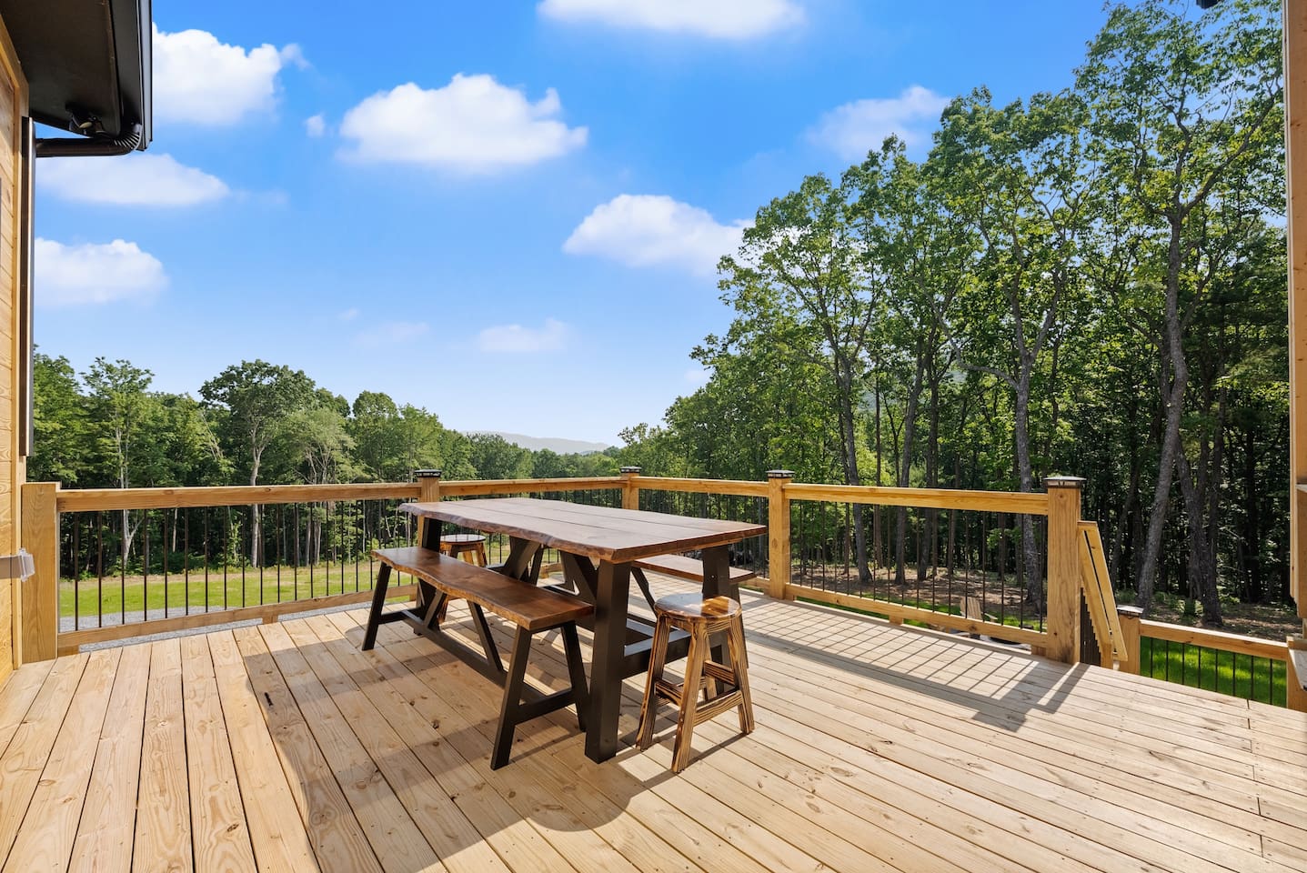 Enjoy alfresco dining with panoramic treetop views from the spacious balcony picnic table.