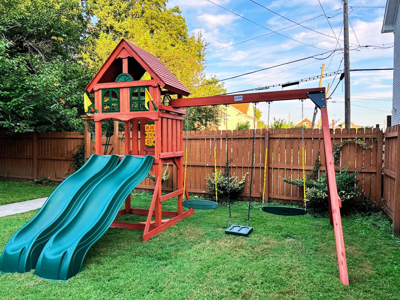 Enjoy the private fully fenced back yard with newly installed swing set playground. 