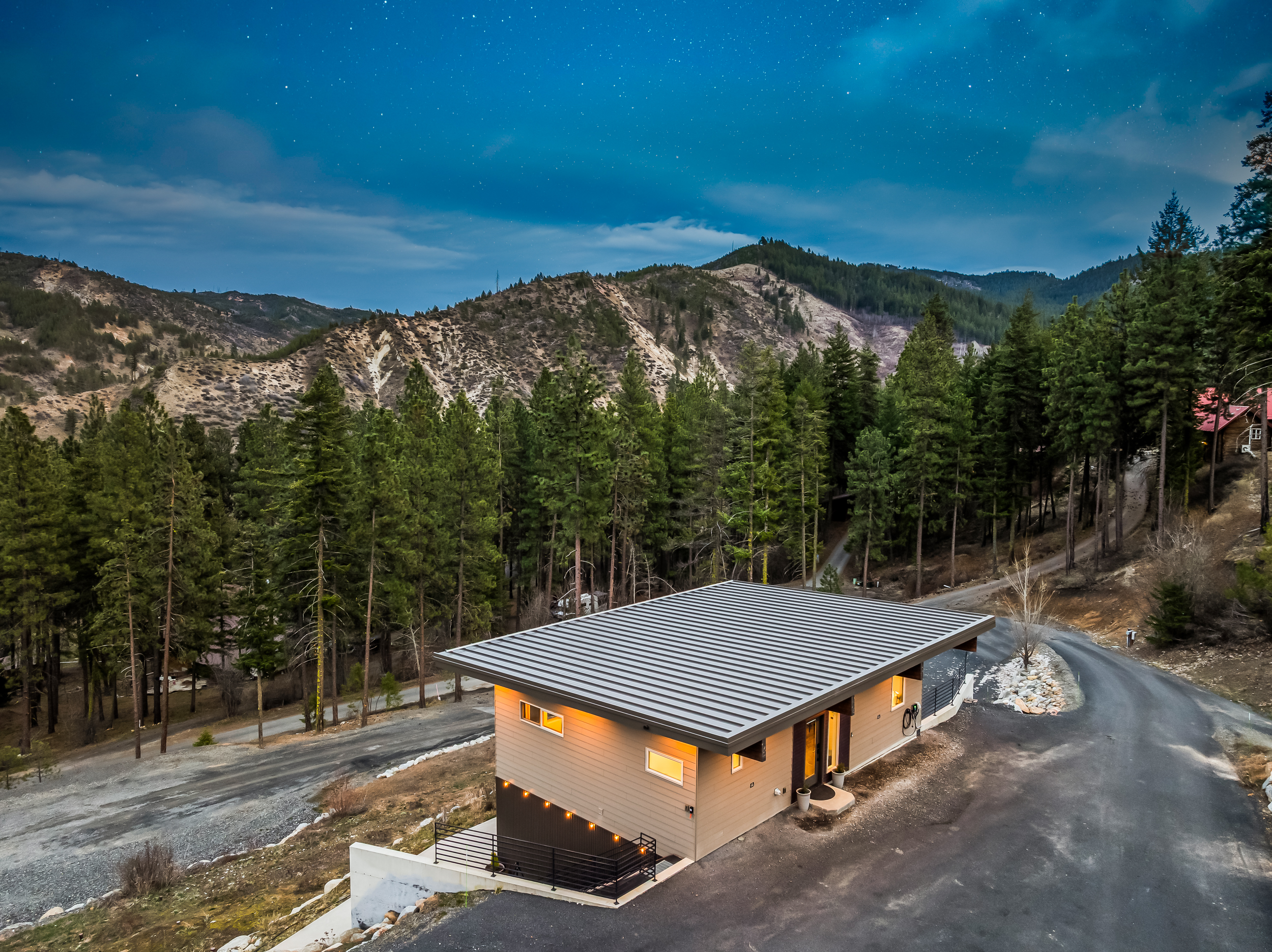 Front entrance and parking area for two vehicles, plus EV charger