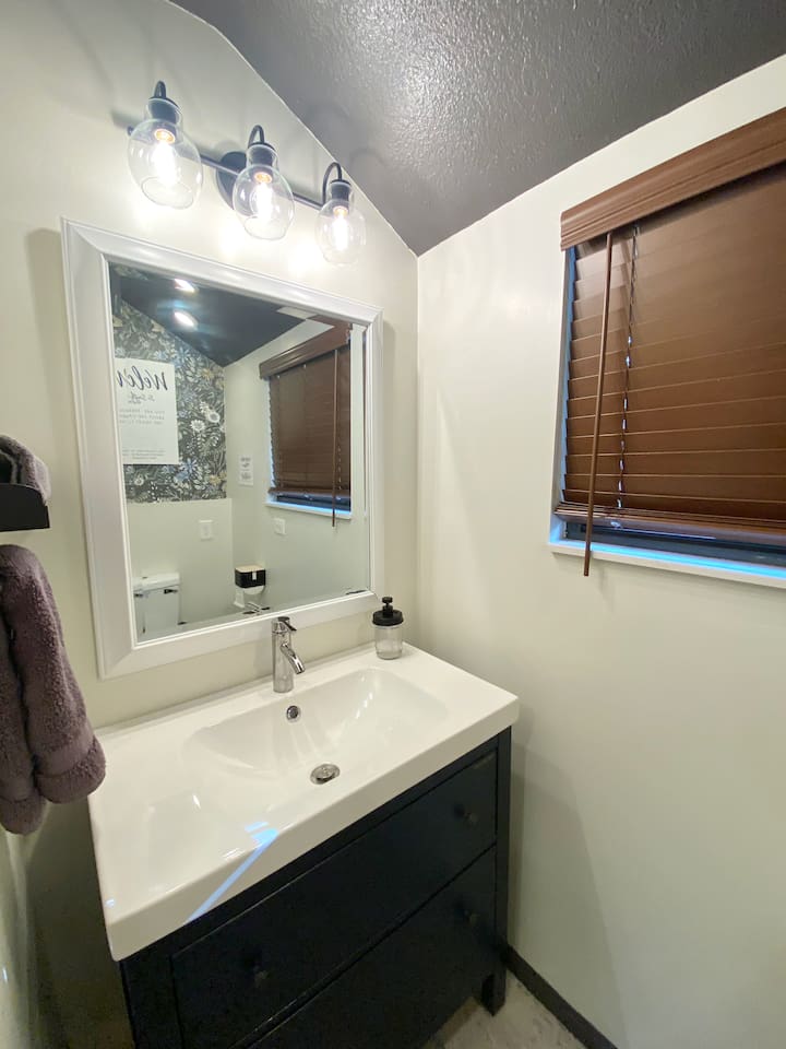 Newly finished 1/2 bath located off the laundry room. 