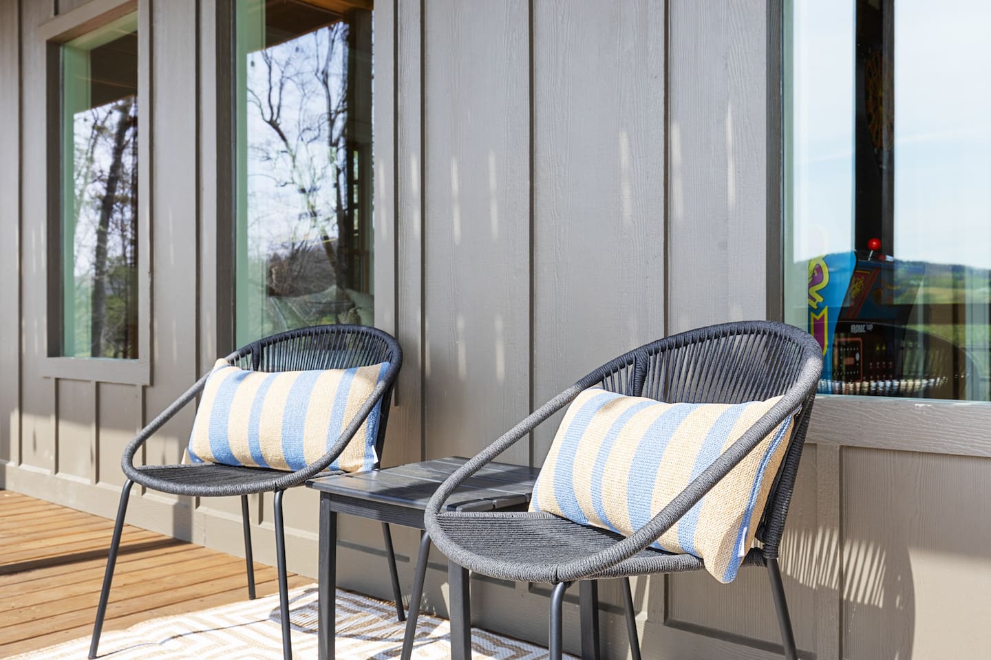 Relax on the lower covered deck with this cozy bistro set. Sink into the woven chairs and sip your morning cappuccino while enjoying the peaceful view of the rolling pasture and distant mountains. Perfect for unwinding in the fresh mountain air.