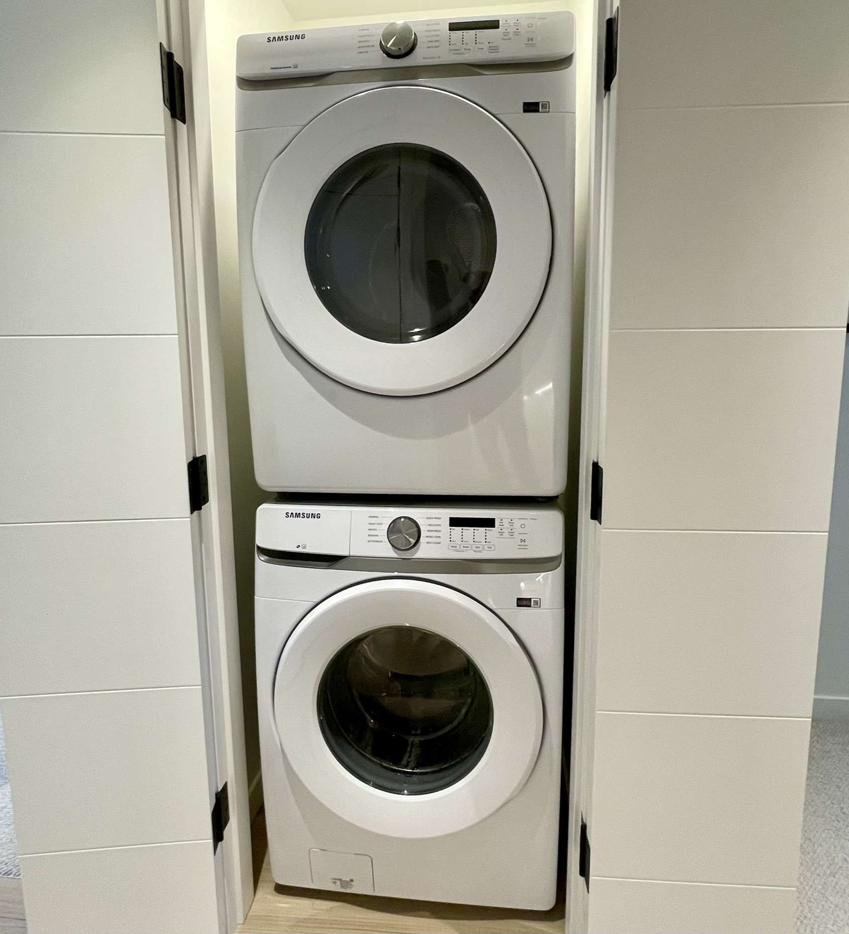 Stacked washer and dryer in closet