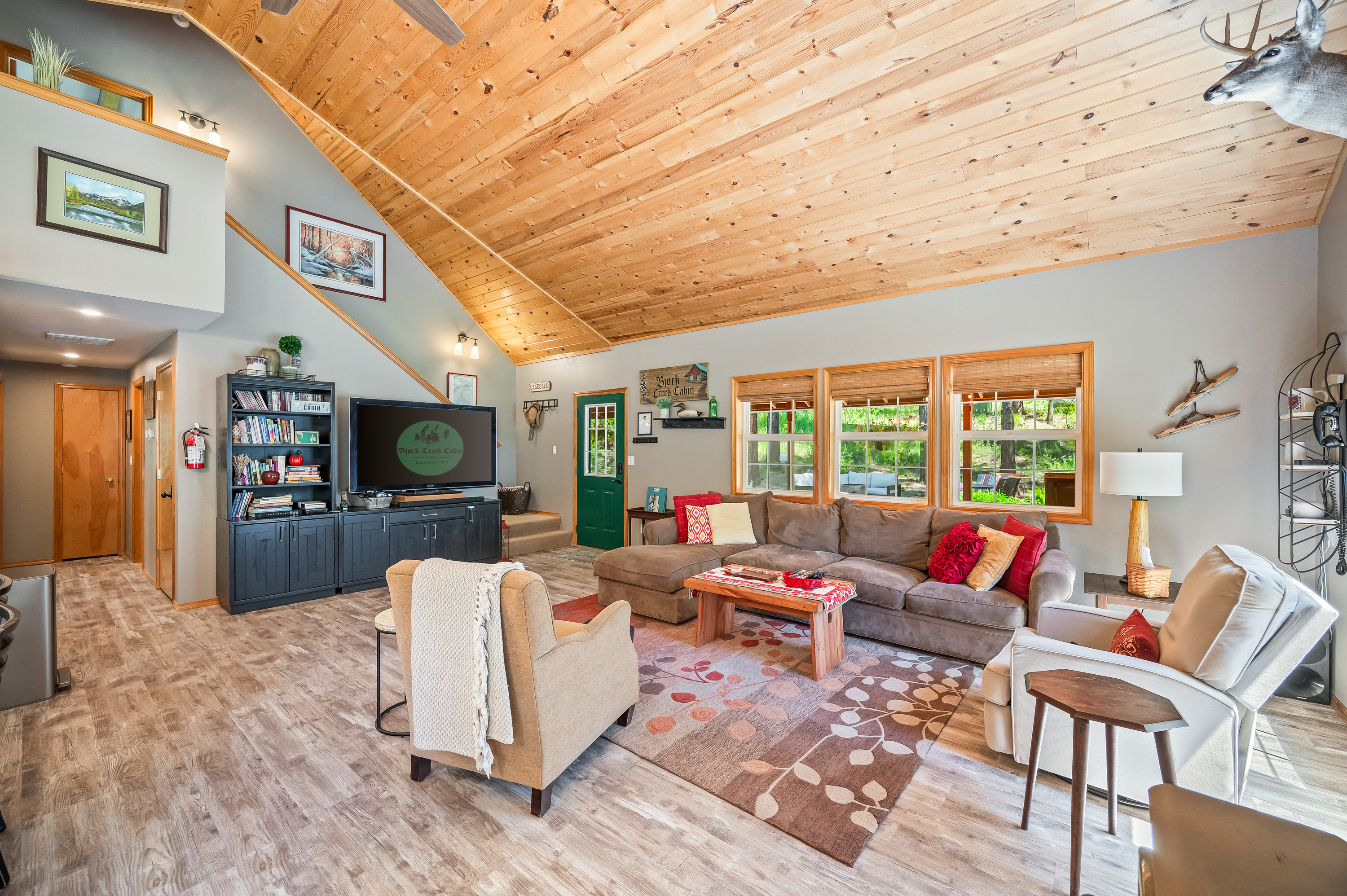 Large open concept living room includes TV with Roku, Wii, Nintendo Switch, and plenty of seating