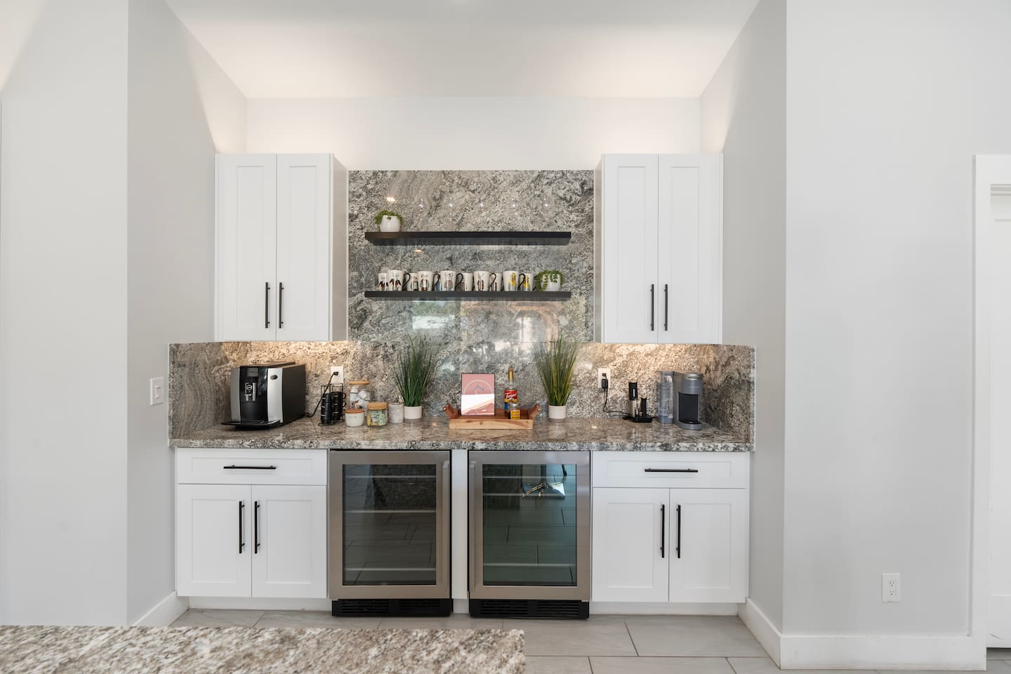 Chic kitchenette with dual beverage fridges.


