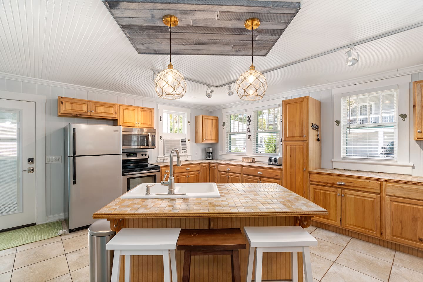 Kitchen with bar-top seating for 3