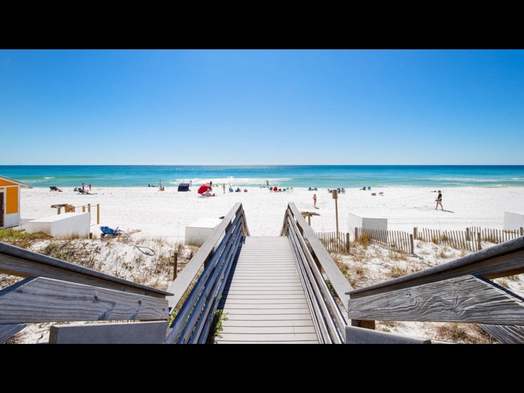 White sand private beach and Emerald water just outside building