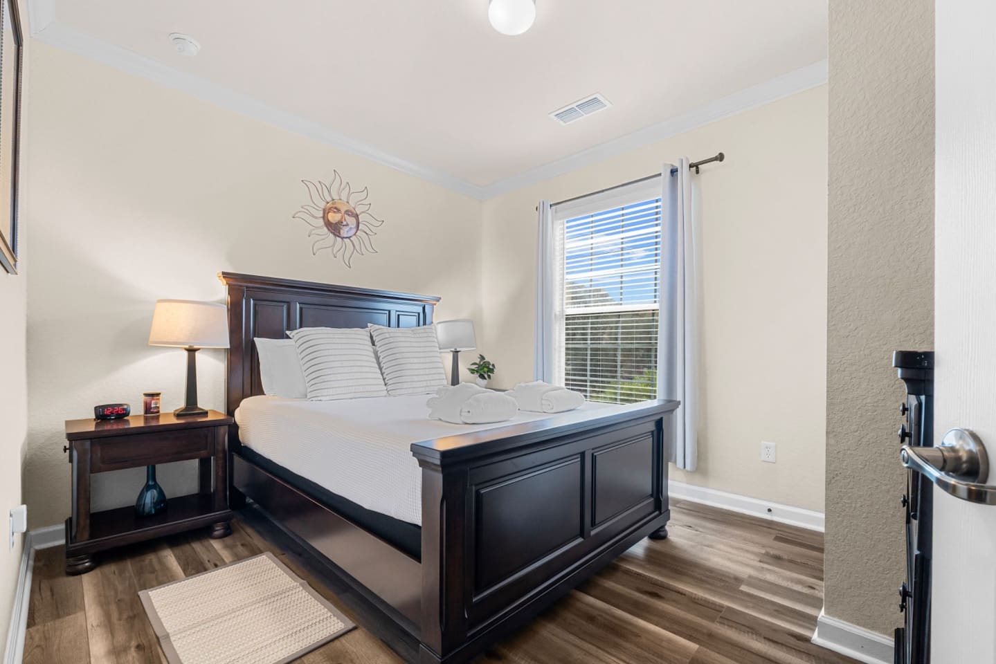 Bright and airy bedroom 2 with a queen bed for a relaxing stay.