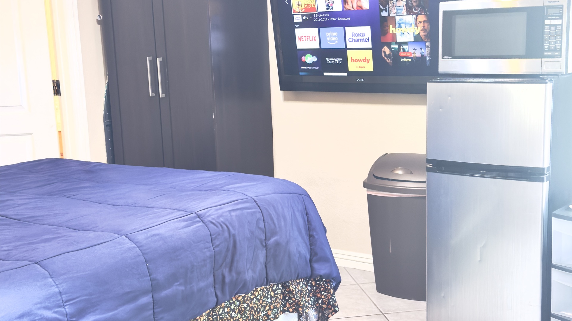 Fully equipped mini kitchen — stainless mini fridge and microwave included