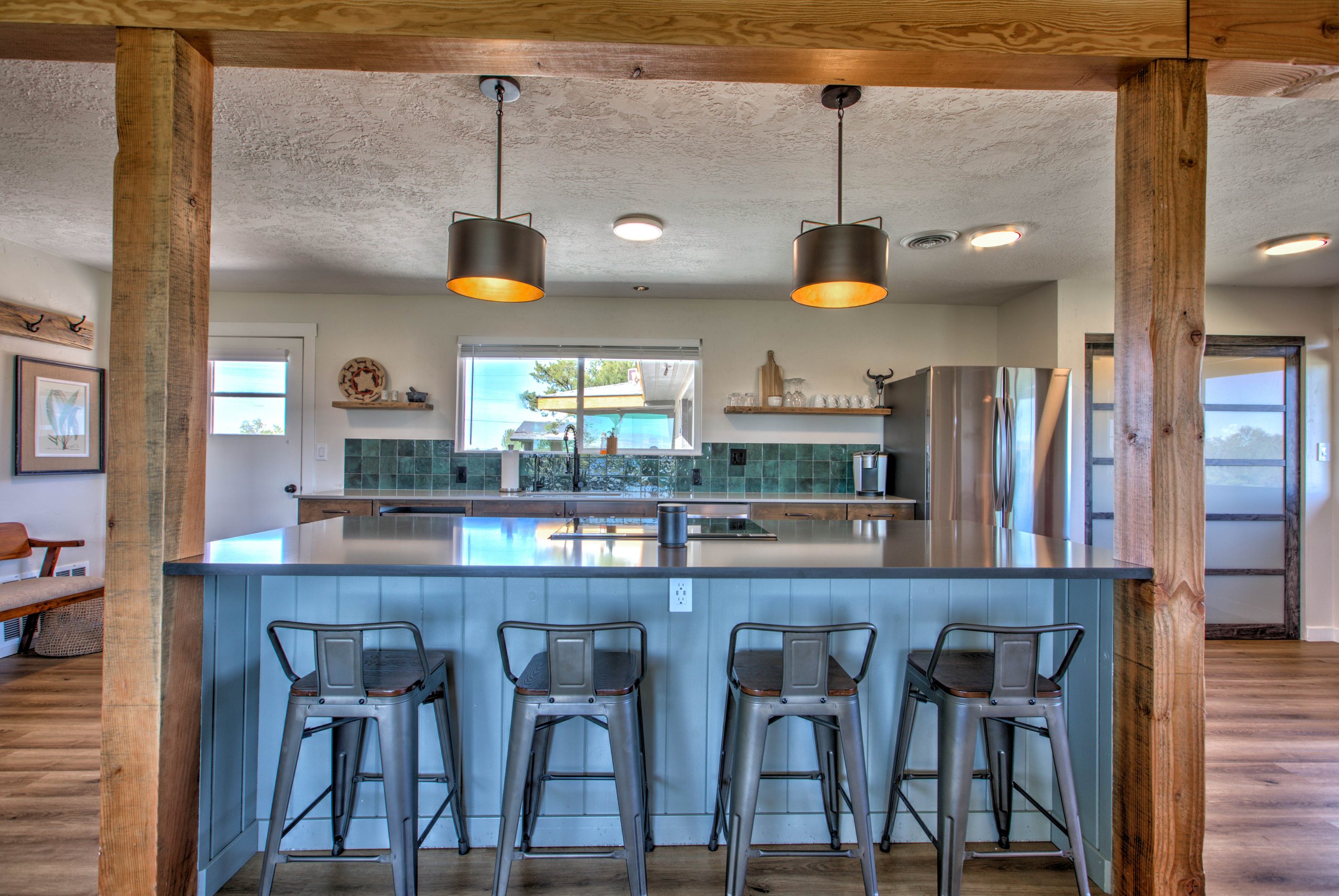 Fully remodeled kitchen with a large island and stainless appliances