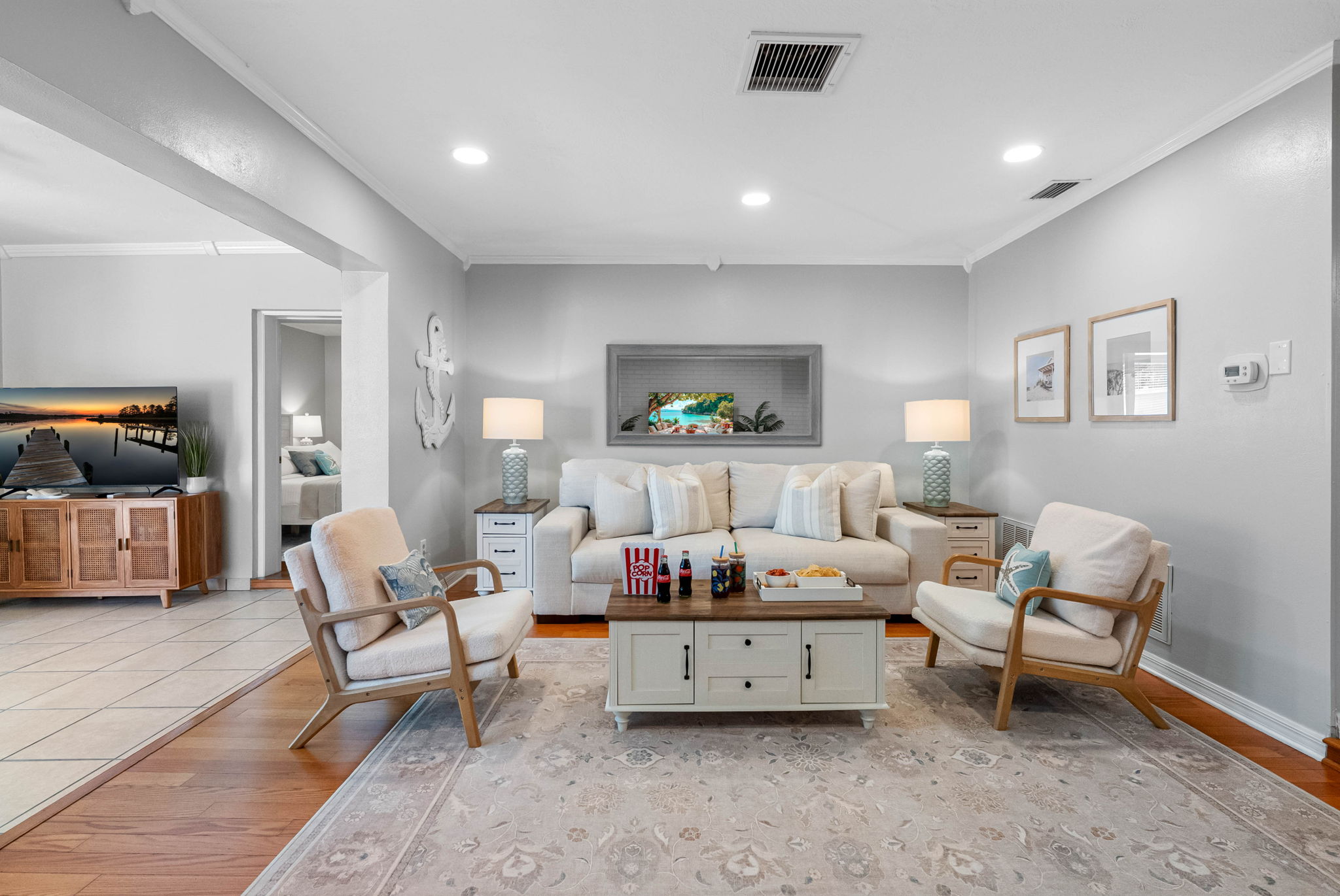 Clean lines, subtle textures, and thoughtful decor come together in this inviting space ideal for unwinding after a day at the beach.