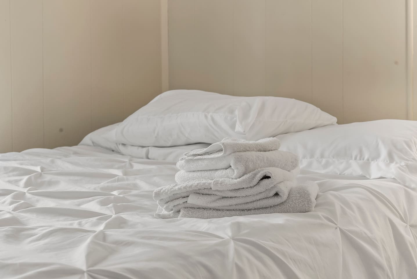 Bedroom two offers comfort and convenience with storage and natural light.