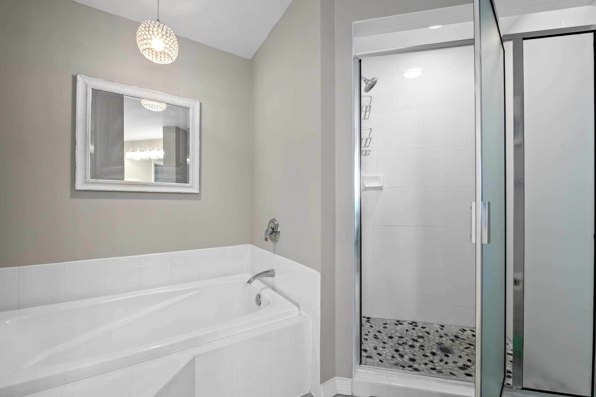 Soaking tub set in a bright bathroom, great for unwinding after a full day.