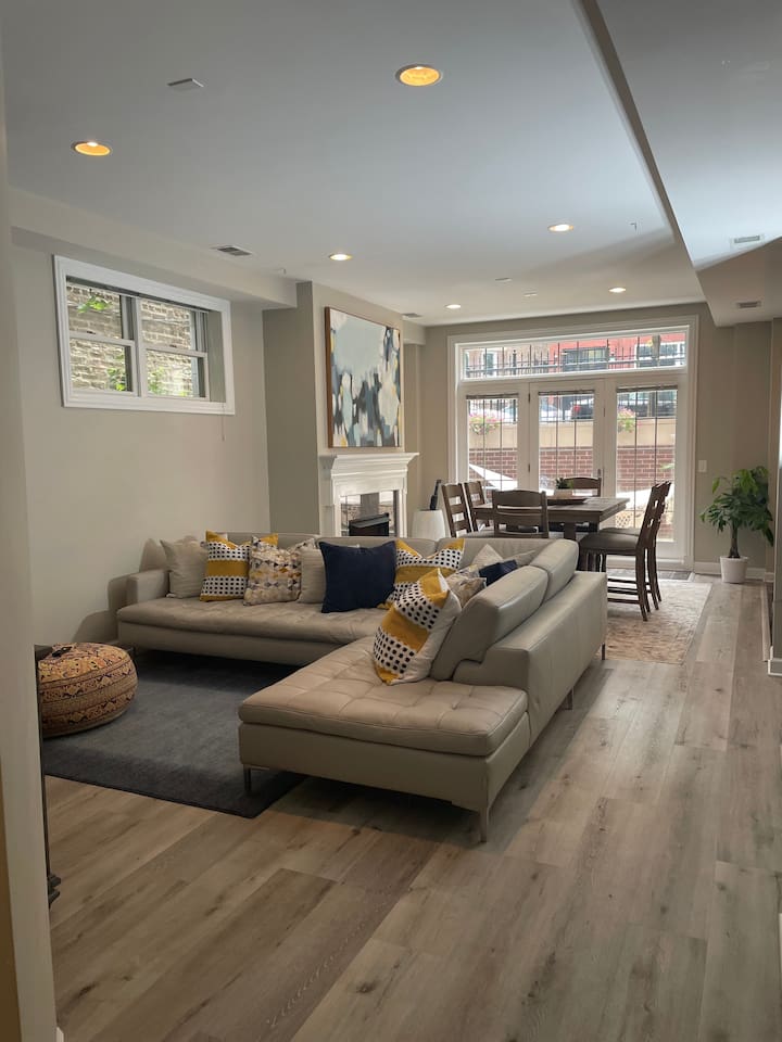 Large open living room with plenty of seating for group gatherings, movies, or relaxing after day downtown