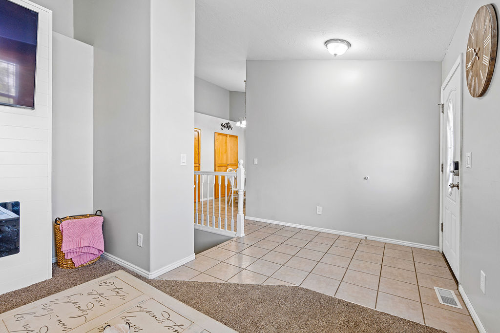 Front door into hallway and kitchen