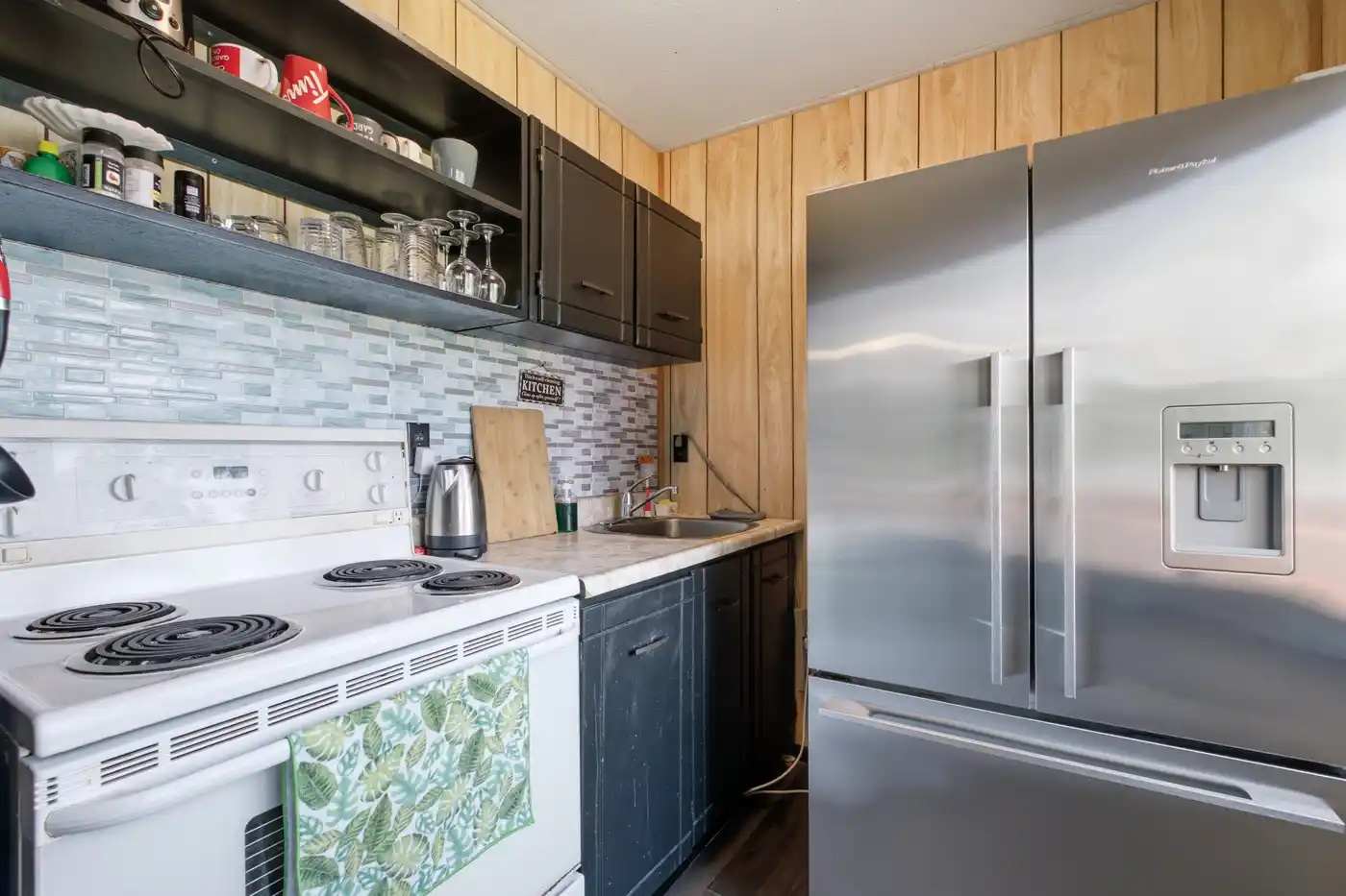 Fully equipped kitchen with stove and full-size refrigerator