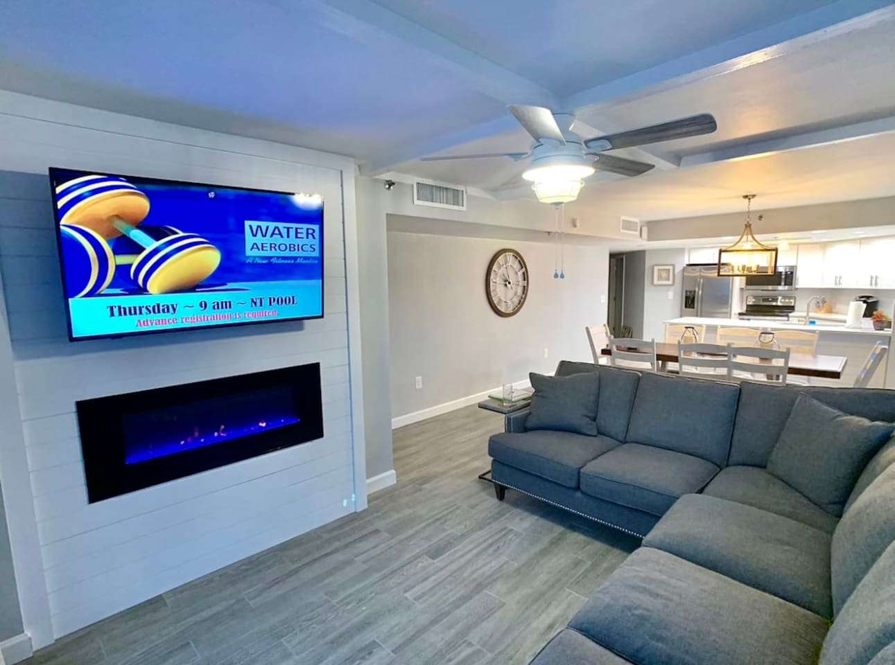 Fireplace in living room with smart Tv. Open floor plan 