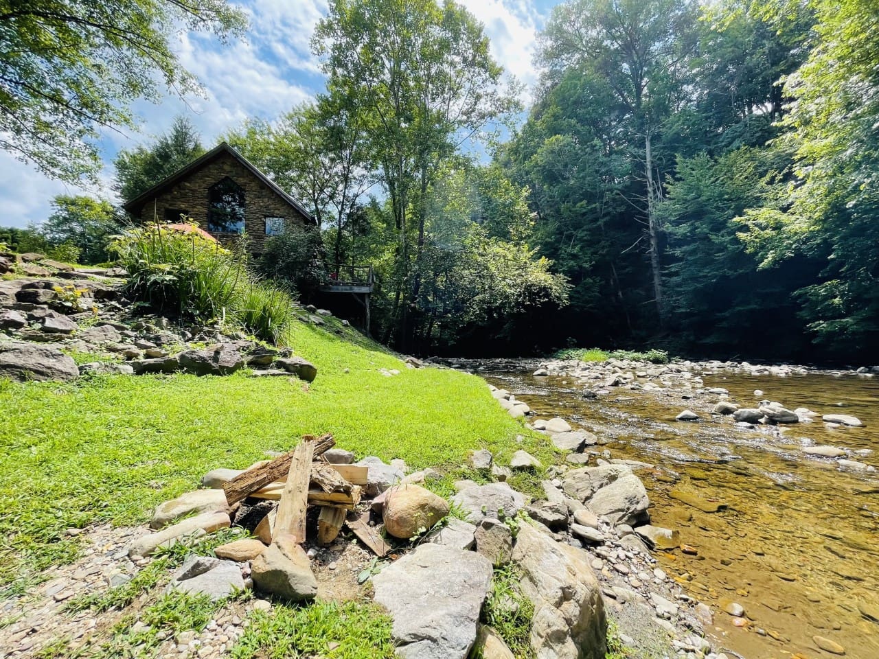 The house looks down on beautiful Spring Creek, has a firepit, and an excellent swimming and fishing hole