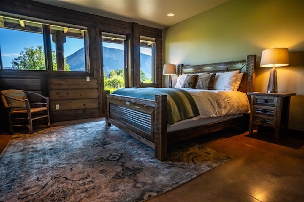 Queen bedroom with private bath and patio access
