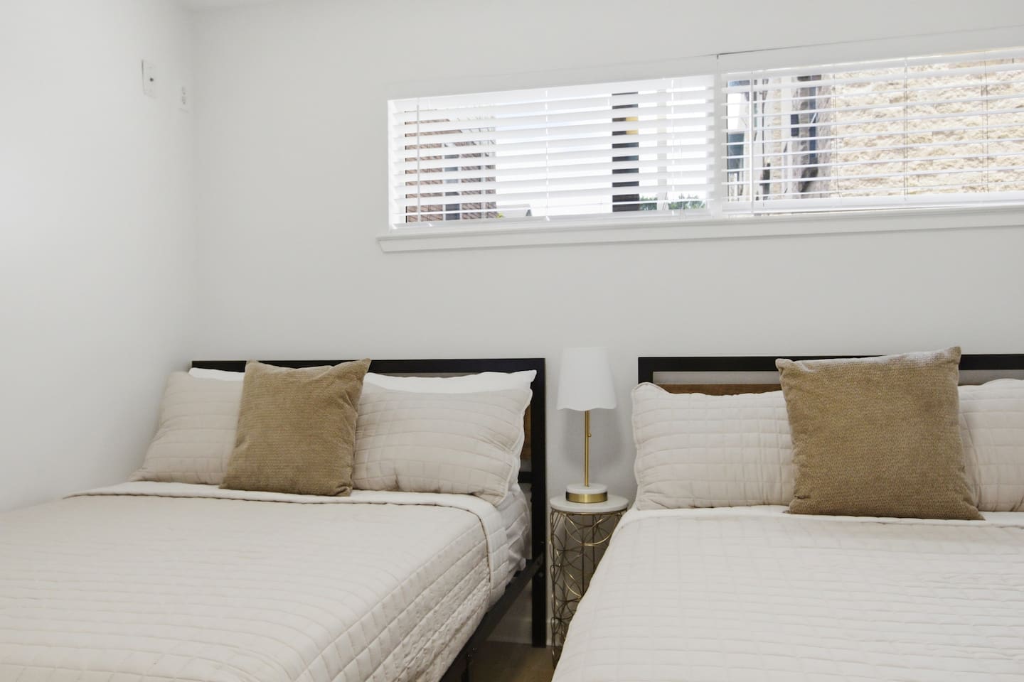 Two Full beds on the first floor with a full bathroom directly nearby. A practical, private sleeping setup for larger groups who want their own floor and their own space.
