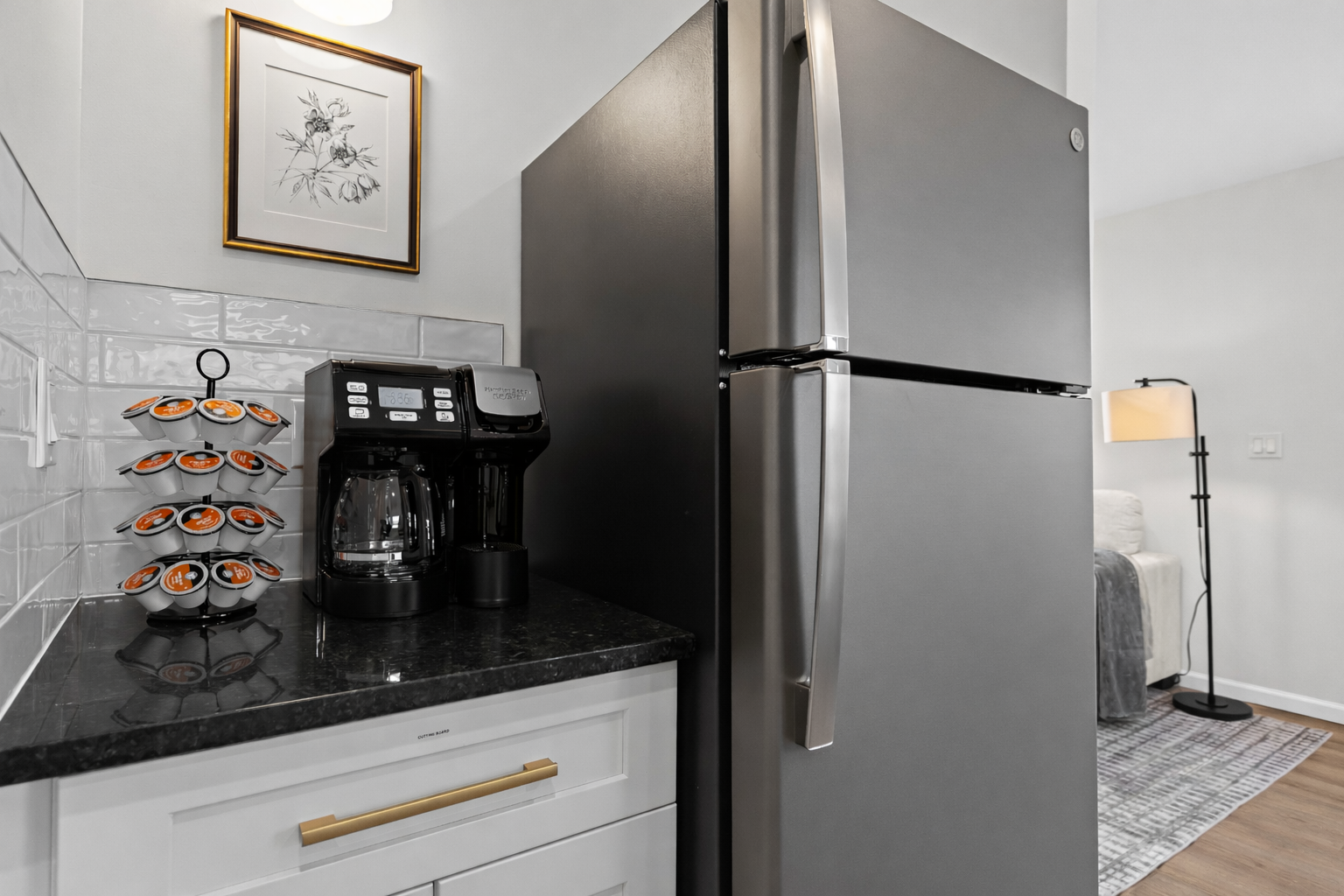 Thoughtfully designed kitchen corner with full-size fridge and coffee station—everything you need for easy mornings and relaxed stays.