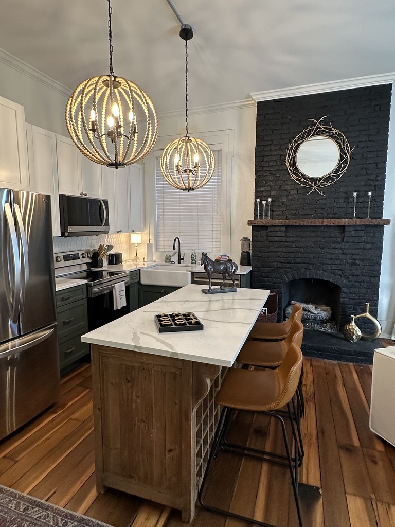 Large kitchen island with 3 leather barstools