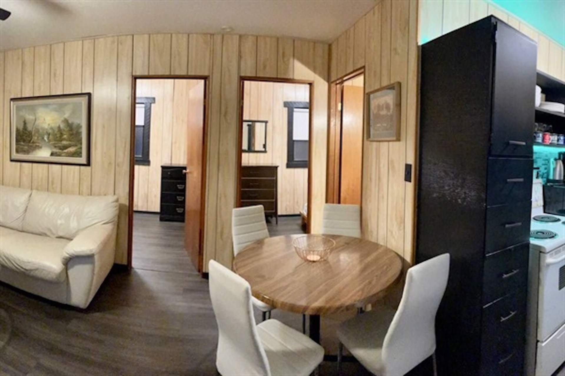 Dining area connecting the living room and kitchen