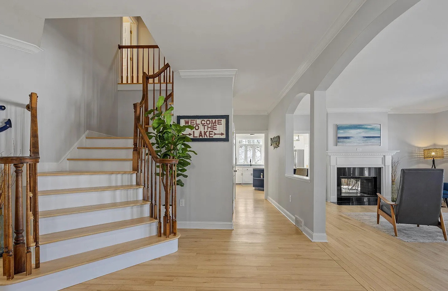 Your first impression says it all - a beautiful winding staircase, open living room, and panoramic lake views greet you upon arrival.